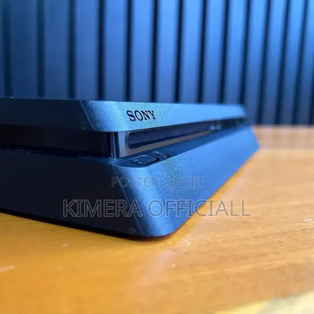 PS4 Slim with 12 Games and 2 Controllers - 1