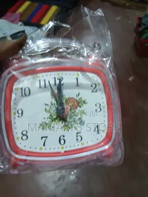 Red Alarm Clock with Vintage Floral Design