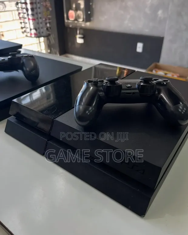 Sony PlayStation 4 with 12 Games and 2 Controllers - 1