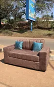 Brown Two-Seater Sofa - 1