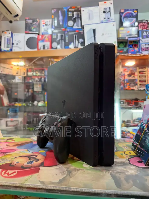 PS4 Slim Console with 12 Games & 2 Controllers - 1