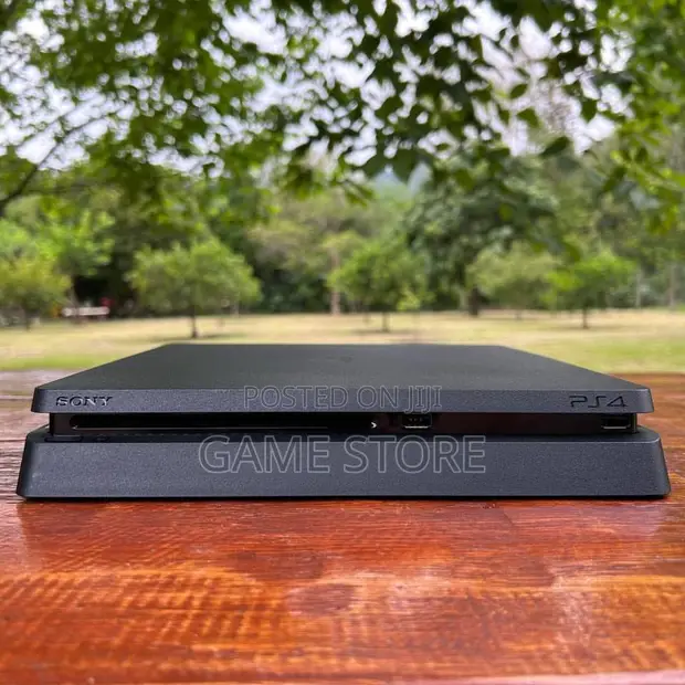 PS4 Slim Console with 12 Games & 2 Controllers - 1