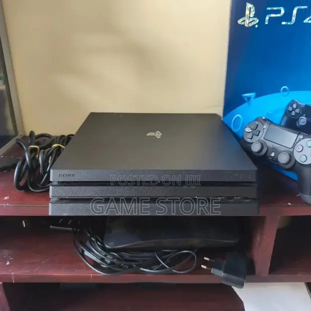 PS4 Pro Console with 12 Games, 2 Controllers - 1