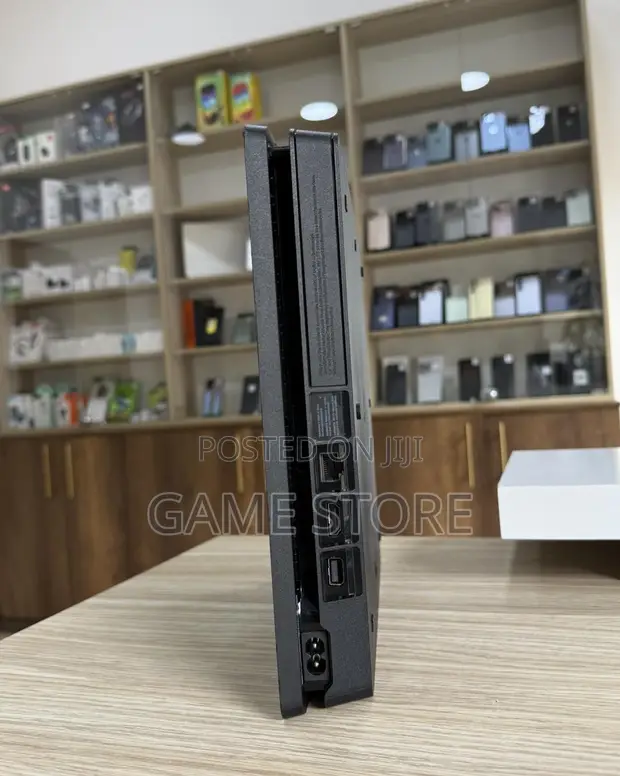 PS4 Slim Console with 12 Games & 2 Controllers - 1