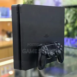 Used Sony PlayStation 4 Slim with 12 Games & 2 Controllers
