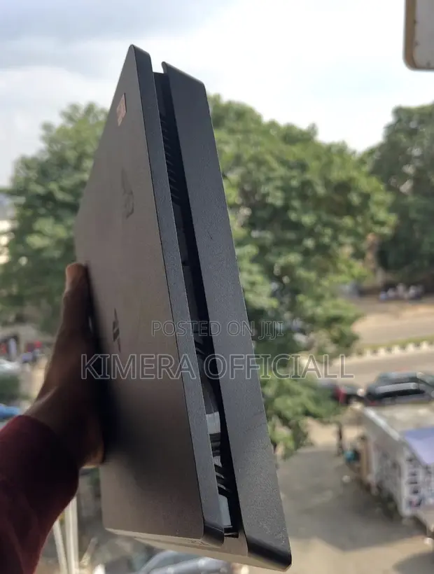 PS4 Slim with 12 Games and 2 Controllers - 1