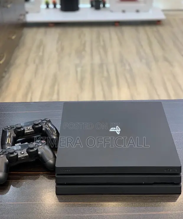 PS4 Pro with 12 Games & 2 Controllers - 1