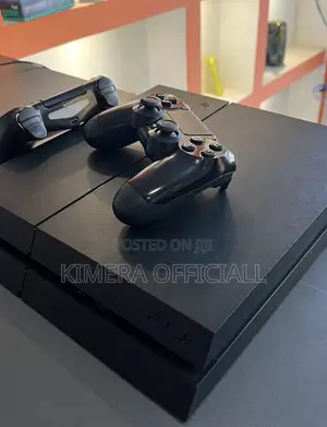 PS4 Fat Console with 12 Games & 2 Controllers