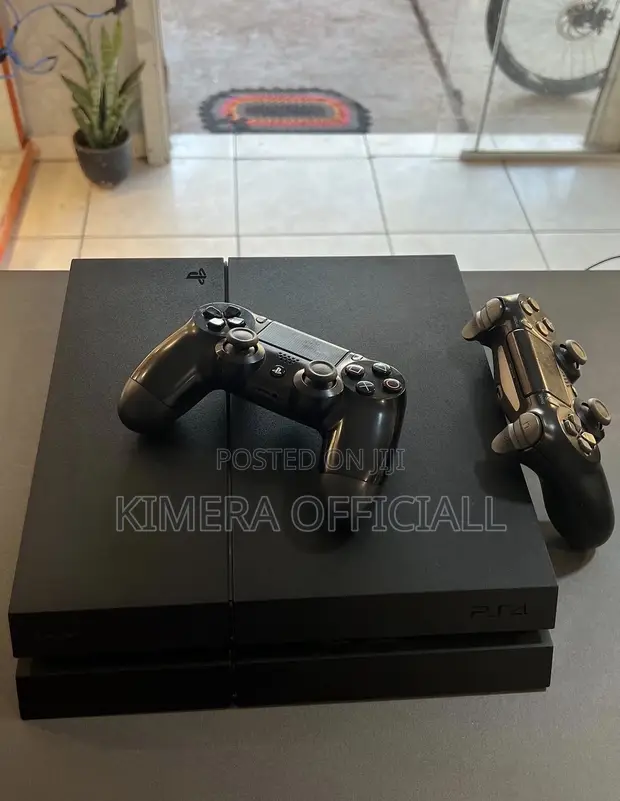PS4 Standard with 12 Games, 2 Controllers - 1
