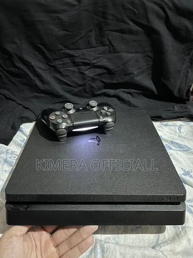 PS4 Slim Console with 12 Games and 2 Controllers - 1