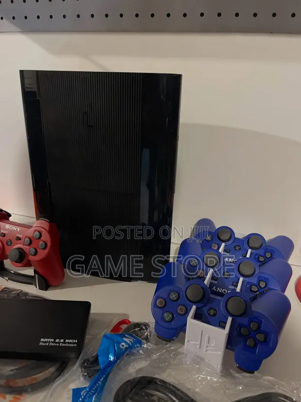 PlayStation 3 Super Slim Console with 2 Controllers & 15 Games - 1