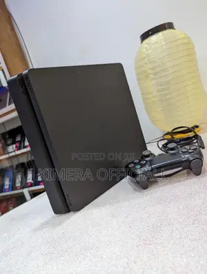 PS4 Slim Console with 12 Games & 2 Controllers