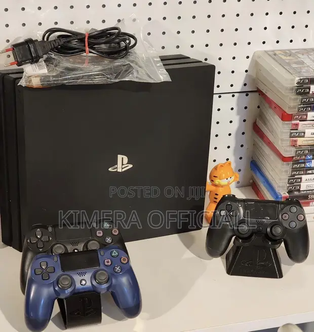 PS4 Pro with 12 Games and 2 Controllers - 1