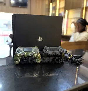 PS4 Slim with 12 Games & 2 Controllers