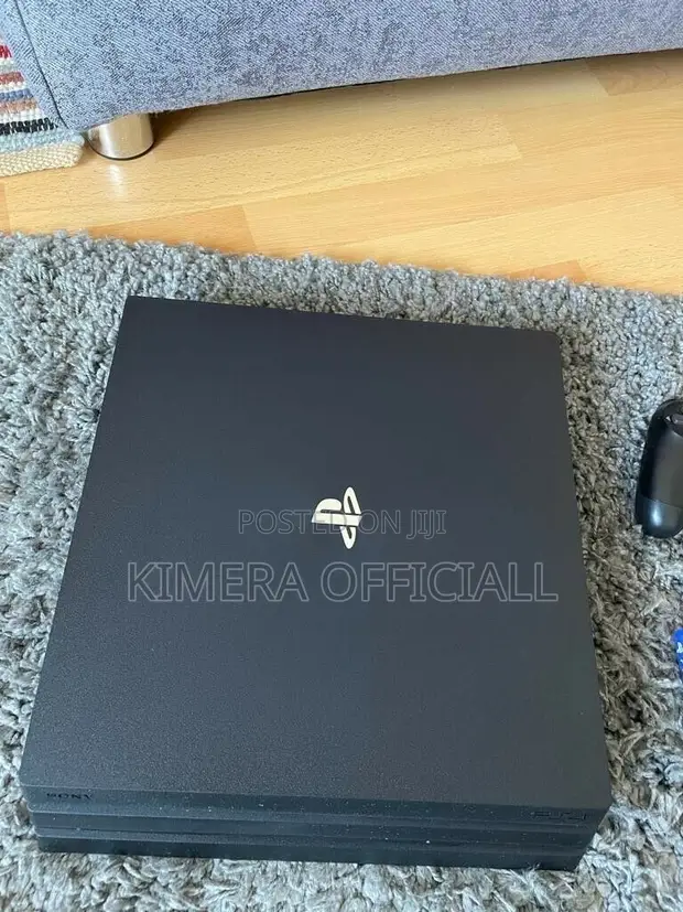 PS4 Pro with 12 Games and 2 Controllers - 1