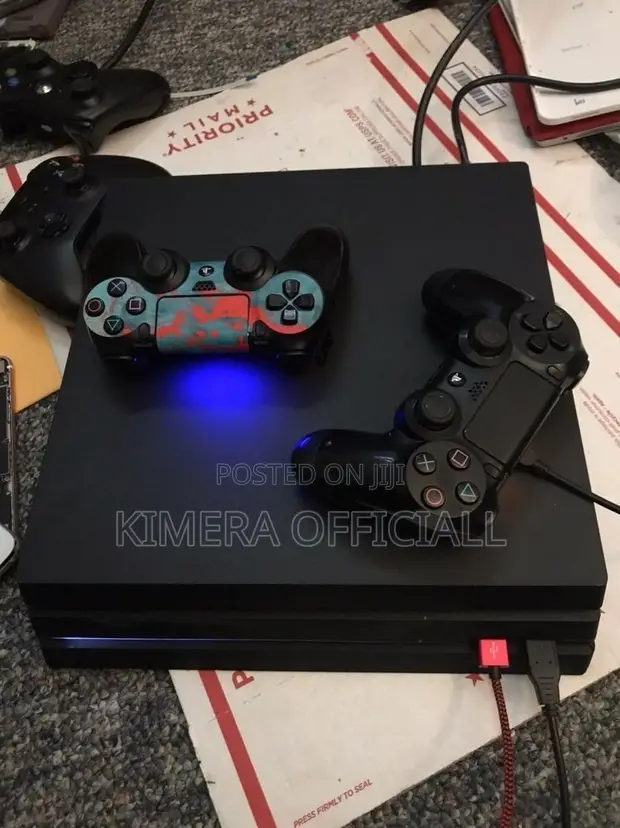 PS4 Pro with 12 Games, 2 Controllers - 1
