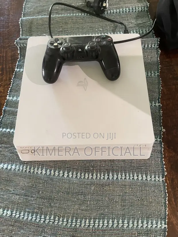 PS4 Slim Console with 12 Games and 2 Controllers - 1