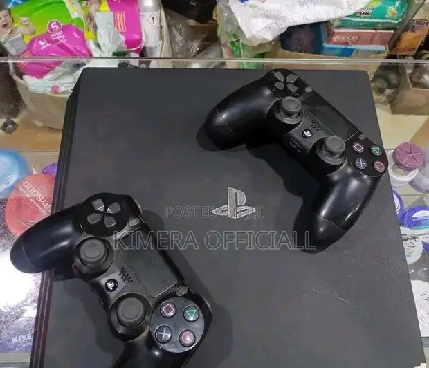 PS4 Slim Console with 12 Games & 2 Controllers - 1