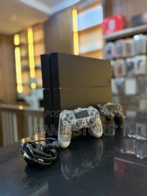 PS4 Fat Console with 12 Games & 2 Controllers