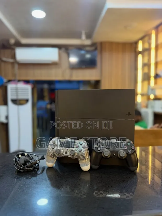 PS4 Standard with 12 Games and 2 Controllers - 1