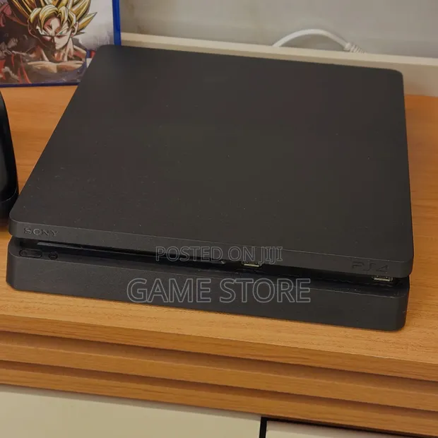 PS4 Slim Console with 12 Games and 2 Controllers - 1