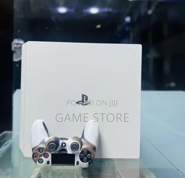PS4 Slim Console with 12 Games & 2 Controllers - 1