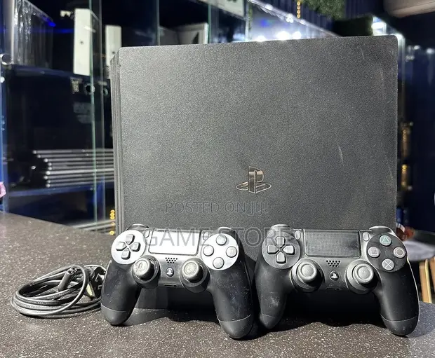 PS4 Slim Console with 12 Games & 2 Controllers - 1