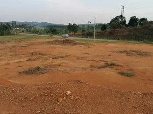 4.7 Acres Commercial Land Touching Tarmac in Kakiri