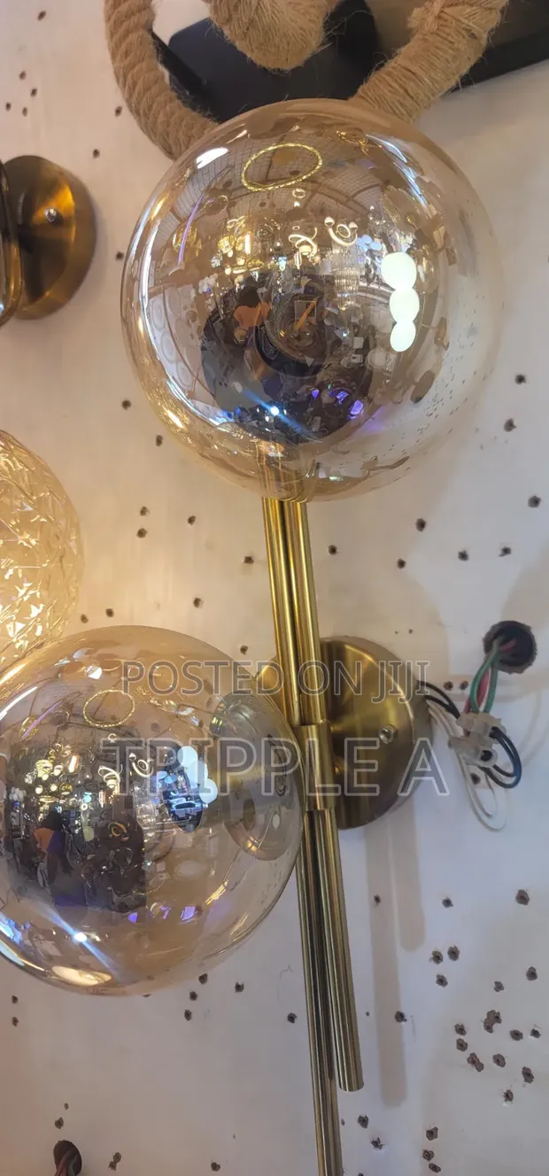 Modern Gold-Finish Wall Sconce with Amber Glass - 1