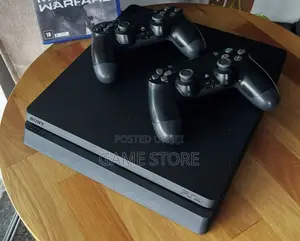PS4 Slim Console with 12 Games & 2 Controllers