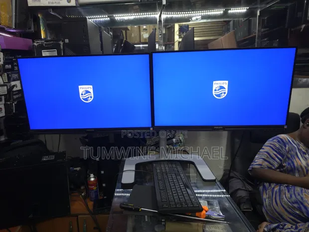2x Philips 27-inch 2K Monitors with Dual Arm Setup - 1