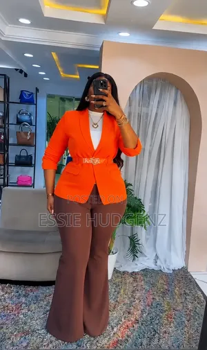 Ladies Orange Blazer with Brown Wide-Leg Pants