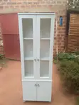Simple White Wooden Sideboard with Glass Shutters - 1