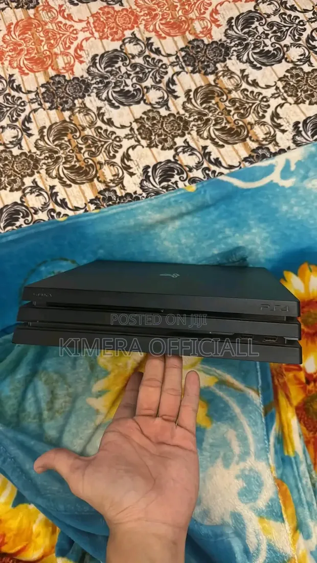 PS4 Pro 1TB Console with DualShock 4 Controller - 1