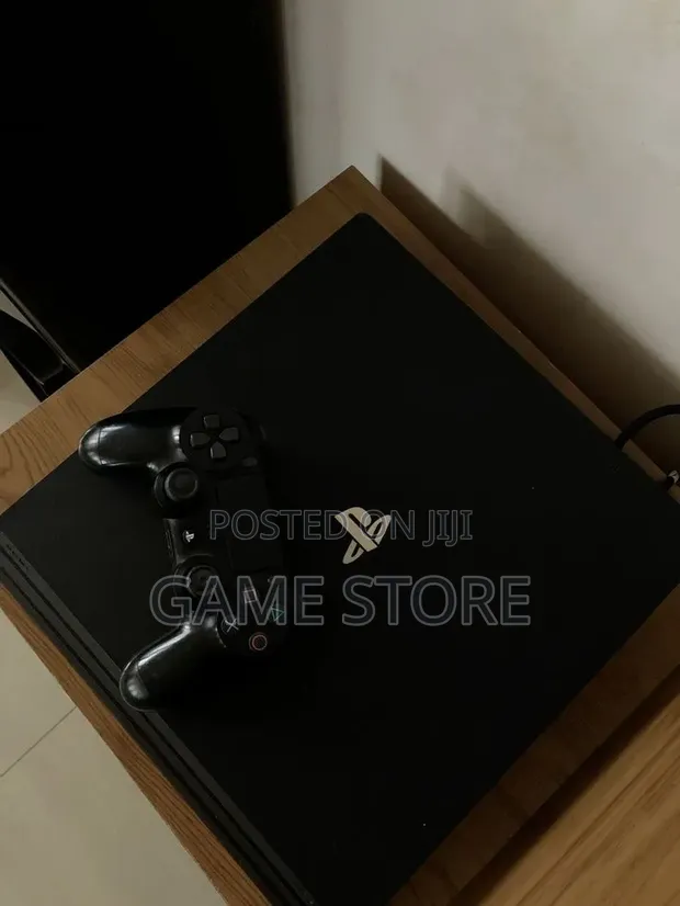 PS4 Pro Console with 12 Games & 2 Controllers - 1
