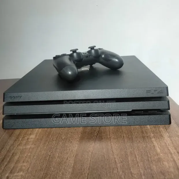 PS4 Pro 1TB Console with 12 Games & 2 Controllers - 1