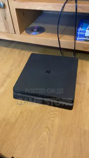 PS4 Slim Console with 12 Games & 2 Controllers