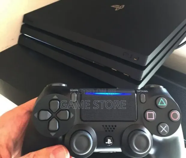 PS4 Pro Console with 12 Games & 2 Controllers - 1