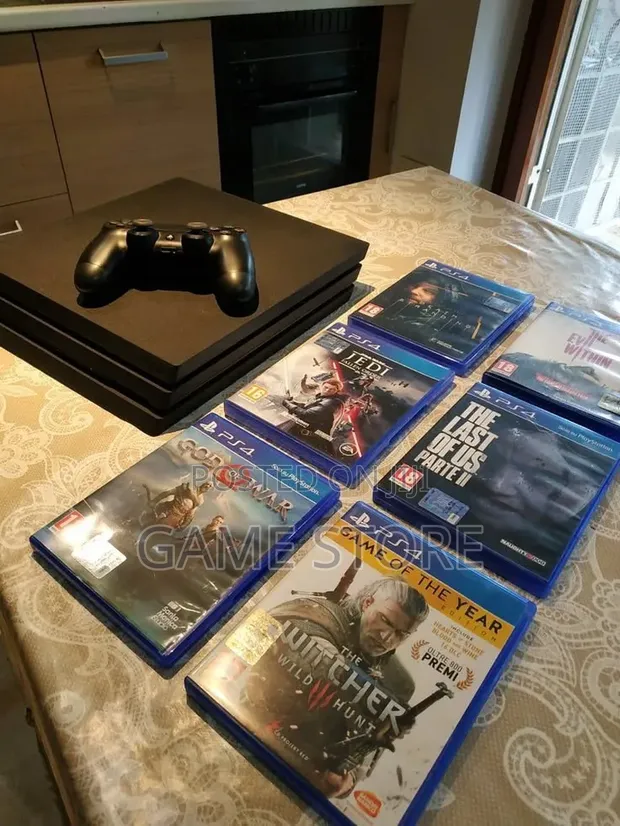 PS4 Pro 1TB Console with 12 Games & 2 Controllers - 1