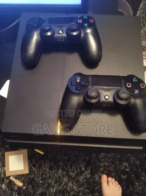 PS4 Standard Console with 12 Games & 2 Controllers
