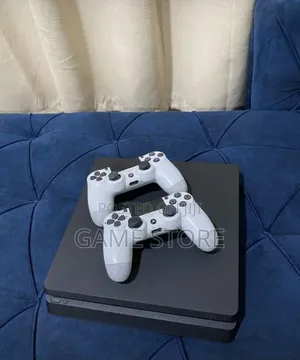 PS4 Slim Console with 12 Games & 2 Controllers