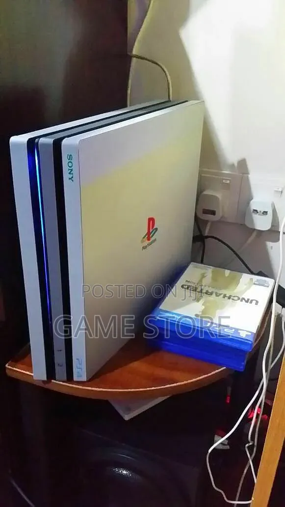 PS4 Pro Console with 12 Games & 2 Controllers - 1