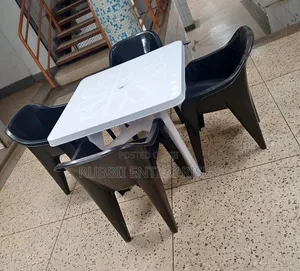 White Dining Table with 4 Molded Plastic Arm Chairs