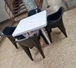 White Dining Table with 4 Molded Plastic Arm Chairs - 1