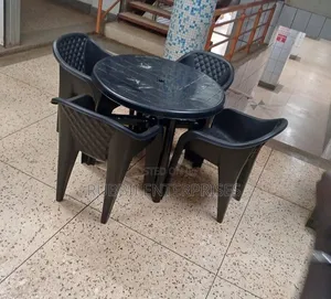 1 Round Table + 4 Molded Plastic Arm Chairs