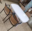 White Oval Dining Table with 4 Rattan Chairs - 1