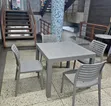 Grey Square Dining Table with 4 Grey Armless Chairs - 1