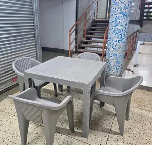 Grey Square Dining Table with 4 Molded Plastic Arm Chairs