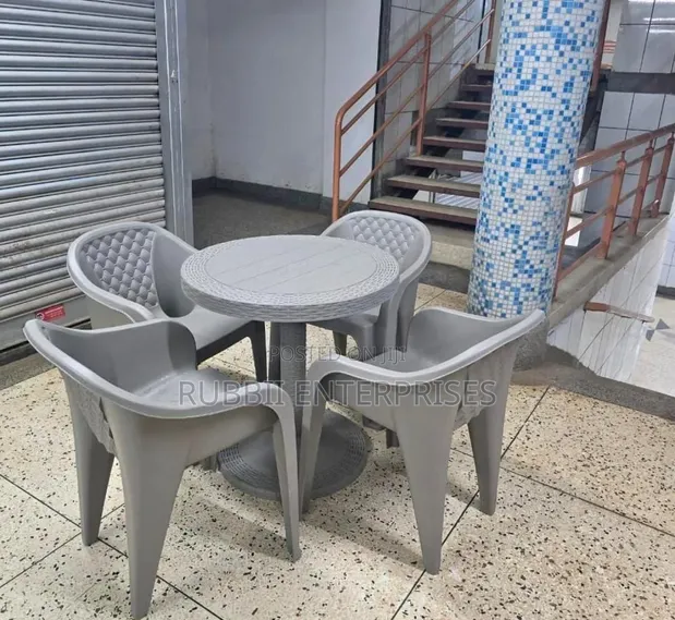 Round Table with 4 Molded Plastic Arm Chairs - 1