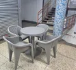 Round Table with 4 Molded Plastic Arm Chairs - 1